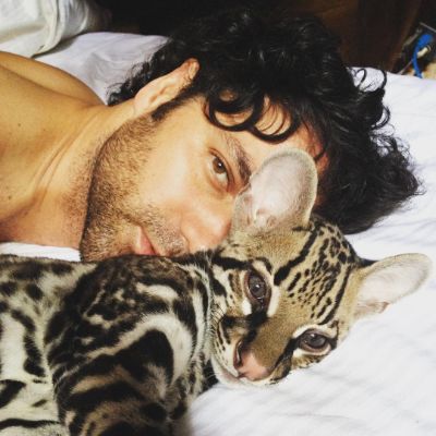 Photo of Valentino Lanus and his cat, Xilam.